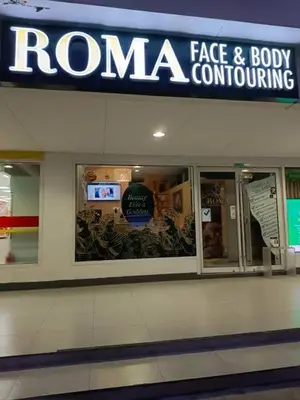 a roma face and body conditioning sign in a building at The Barn at Sea Residences in Manila