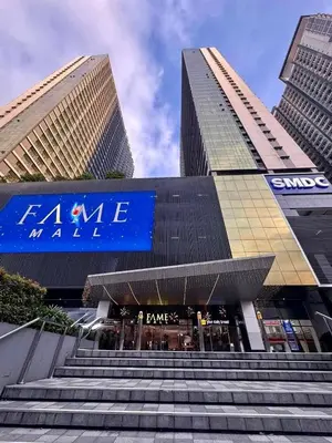 a set of stairs in front of two tall buildings at The Place To Be with Balcony and Kitchen Mandaluyong in Manila