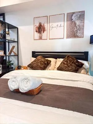 a bedroom with two beds with towels on them at Casa Del Sol in Manila