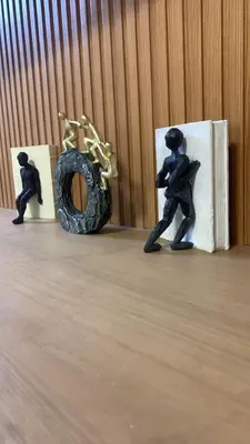 two figurines of a man playing a saxophone on a table at Klassi Executive Stay near NAIA in Manila