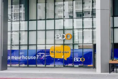 a glass building with a bdo sign in the window at Shore Residence Tower A w Pool Near Airport and MOA in Manila