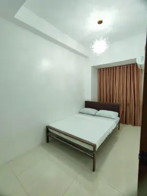 a bedroom with a bed in a room at Stay Manila Hostel in Manila