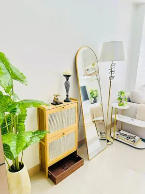a living room with a mirror and a dressing table at Family Oasis at Leaf with Netflix in Muntinlupa in Manila
