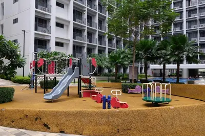a playground in front of a large building at Urban Luxe Suite - Shore 2 Residences, Steps to Mall of Asia Complex, Pasay City in Manila