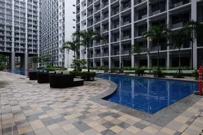 a swimming pool in the middle of a building at Urban Luxe Suite - Shore 2 Residences, Steps to Mall of Asia Complex, Pasay City in Manila