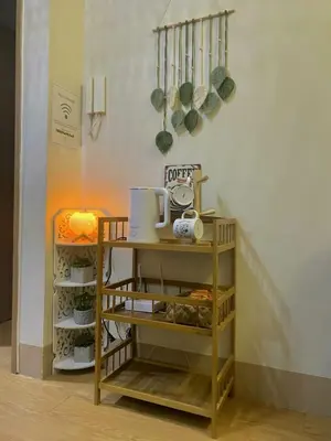 a shelf with some food on it in a room at The Azelea Suites By Azel in Manila