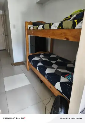 a bedroom with two bunk beds in a room at Moa view sea Residences condotel in Manila