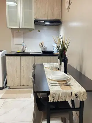 a kitchen with a table with a plate on it at D'Hauz 3 - Pet Friendly unit in Manila