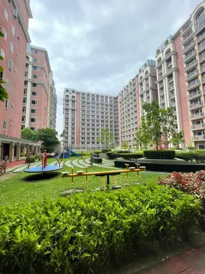 a park with a picnic table in the middle of buildings at D'Hauz 3 - Pet Friendly unit in Manila