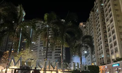 a sign that says miami city in front of tall buildings at The Morgan Residences in Manila