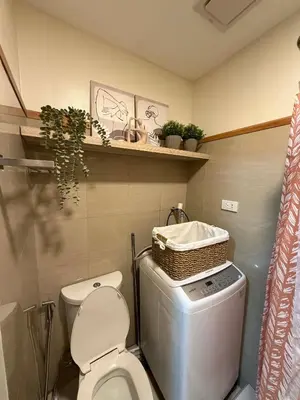 a bathroom with a toilet and a basket on top at Twin Bed 1BR w Balcony with WiFi Netflix at Shore2 T1 near MOA and NAIA Airport in Manila