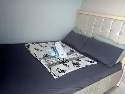 a small bed with a mattress and pillows on it at Sea Residences Tower EF Rose in Manila