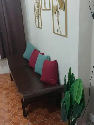 two pillows sitting on a bench in a room at Affordable Townhouse Imus cavite greenpark villas 2 in Imus