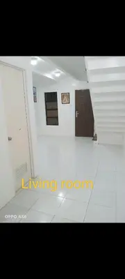 a large white room with a living room at One Cenon place in Postema
