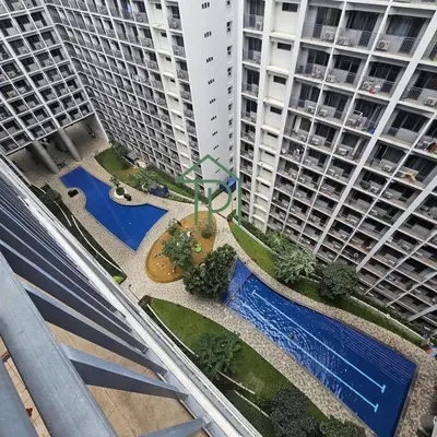 an aerial view of a courtyard between two tall buildings at 1BR Pool View Balcony Near MOA Shore 2 Tower 1 in Manila