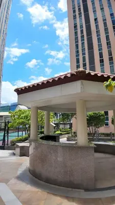 a pavilion in front of a large building at Venice Luxe Cozy 1 BedRoom, Pool, Netflix, Kitchen, Canal Mall Access in Manila