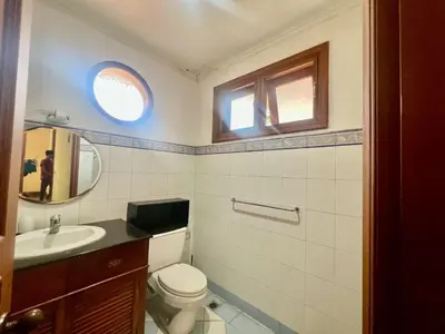 a bathroom with a toilet and a sink at Happy Place Antipolo in Antipolo