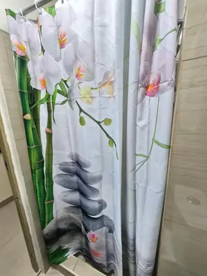 a curtain with a picture of flowers on it at Zen 2 Shore A Residences in Manila