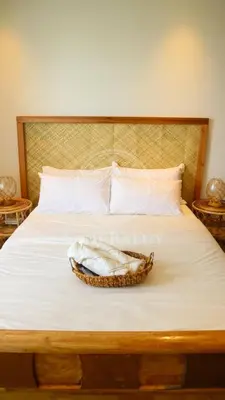a bed with a basket on top of it at 3 min to Rockwell City View Pool Parking in Manila