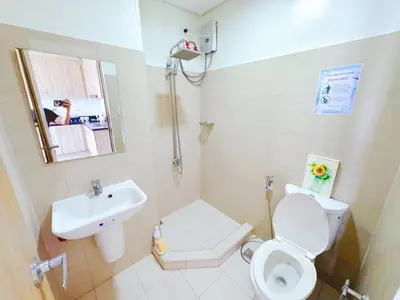 a small bathroom with a toilet and a sink at Manila bay view Shore2 Two bedrooms in Manila