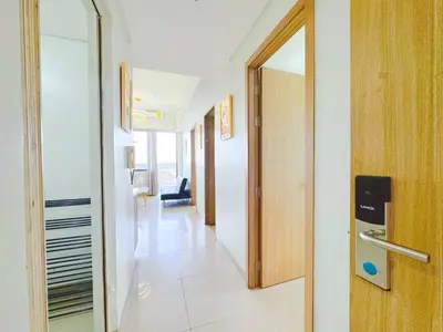 a hallway with a door leading to a room at Manila bay view Shore2 Two bedrooms in Manila