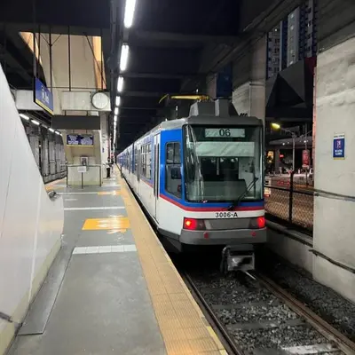 a train is pulling into a subway station at Comfy 1BR Self Check-In at Light Residences in Manila