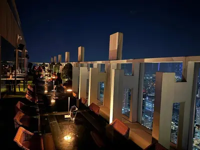 a balcony of a building with a view of the city at The Residences BCCT in Manila