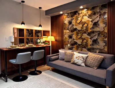 a living room with a couch and a bar at Shore 2 Residence Erlinda suite in Manila