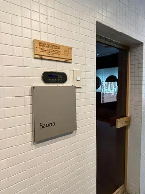 a sign on a wall next to a door at Deluxe Room with Pool View Unit in Poblacion in Manila