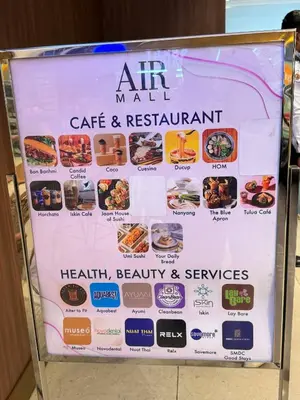 a sign for an air mall cafe and restaurant at Budget-Friendly Condo in Makati in Manila
