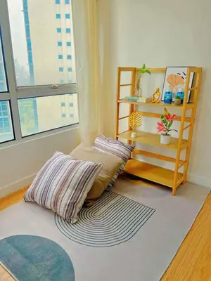 a room with two pillows sitting on a rug at Luxury 2BR with Stunning Skyline Views in BGC in Manila
