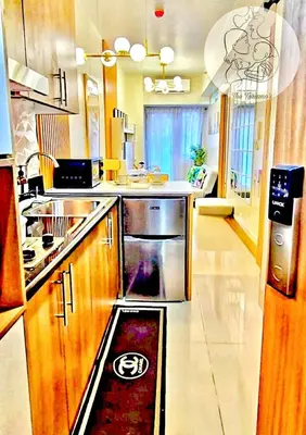 a kitchen with a sink and a stove at The Turianos in Manila