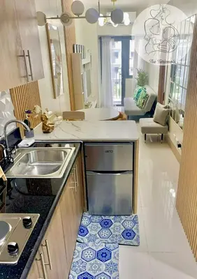 a kitchen with a sink and a counter top at The Turianos in Manila