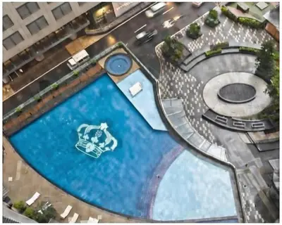 an overhead view of a large swimming pool at STAYLUXIA BOUTIQUE HOTEL KNIGHTSBRIDGE Pool Netflix Free Amenities in Manila