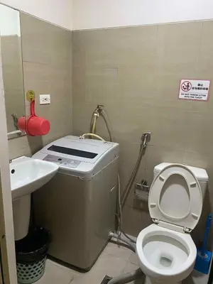 a small bathroom with a toilet and a sink at Shore residence A42 shortwalk mall of asia in Manila