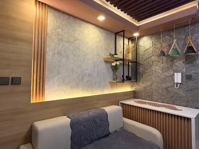 a spa room with a tub and a bench at Bayshore Getaway Condotel ByClowie in Manila