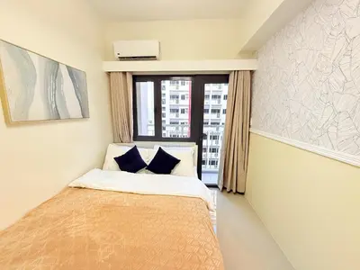 a small bedroom with a bed and a window at Bright Unit at Bloom near NAIA l WiFi Netflix BLOOM B02-0803 in Manila