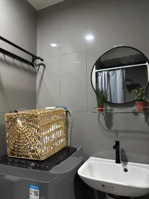 a bathroom with a sink and a mirror at Air Residences Makati CBD 1BR w Balcony in Manila