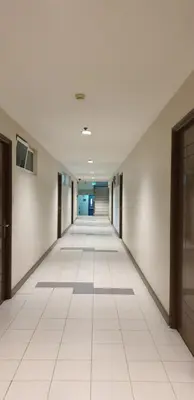 an empty hallway in an office building at AC's Suite in Manila