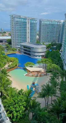an aerial view of a resort with a swimming pool at Azure Resort Condo with Man-Made Beach Pool in Manila