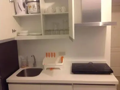 a kitchen with a sink and a counter top at Azure Resort Condo with Man-Made Beach Pool in Manila