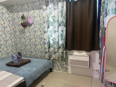 a small room with a bed and a window at Budget Friendly Staycation -Ualat in Manila