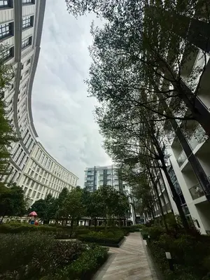a walkway in a city with tall buildings at Place to stay in Pasay in Manila