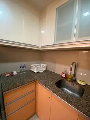 a kitchen with a sink and a counter top at Place to stay in Pasay in Manila