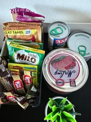 a drawer filled with different types of food and snacks at Modern Condo in Makati with Stylish City Escape in Manila