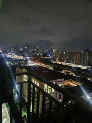 a view of a city at night with lights at D'Annes Holistay in Manila