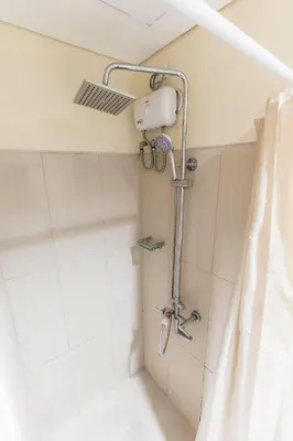 a shower in a bathroom with a shower curtain at shell residences condo walk to Mall of Asia in Manila