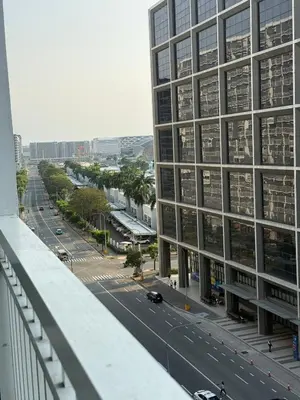 a view of a city street with a tall building at City Elite Retreats at Shore in Manila
