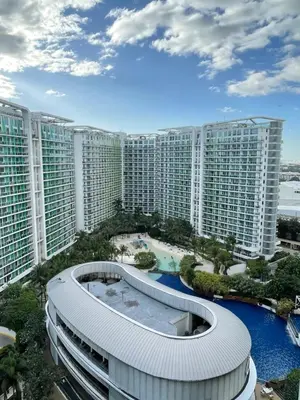 arial view of a large building with a pool at Calme Corner Azure Urban Residences Maldives Tower in Manila