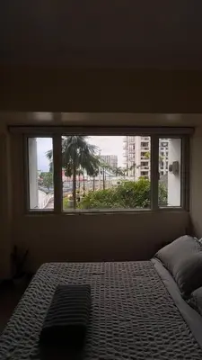 a window in a bedroom with a bed with a view at Solemare Parksuites -Tower C in Manila
